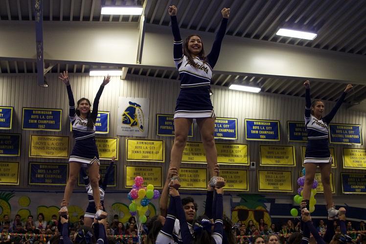 Cheerleaders demonstrating an extension at the pep rally