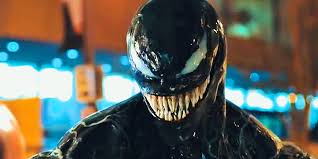 Venom smiling as his movie claims the top spot at the box office.