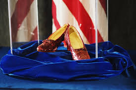 A pair of red ruby slippers being displayed at the museum.