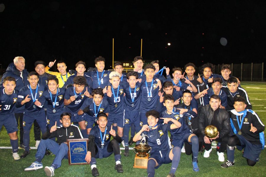 The+BCCHS+Soccer+Team+after+winning+the+2019+City+Championship.