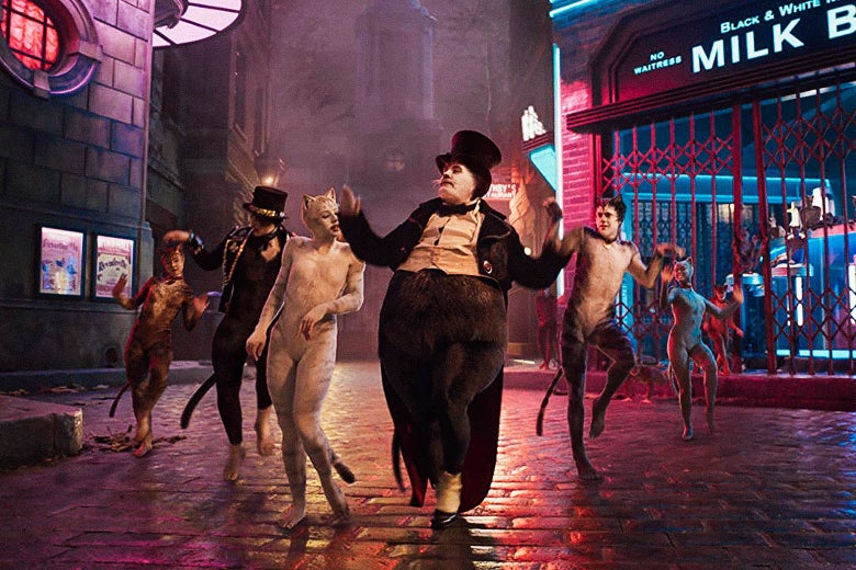 Bustopher Jones, played by James Corden, standing front and center with other cats in the back.