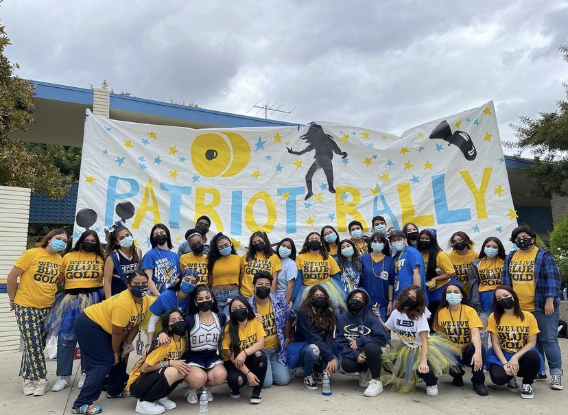 ASB showing their blue and gold pride  in front of a Friday Pep Rally poster