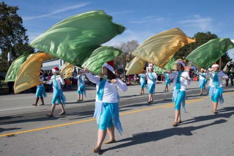 A High School Color Guard Performing in a Parade