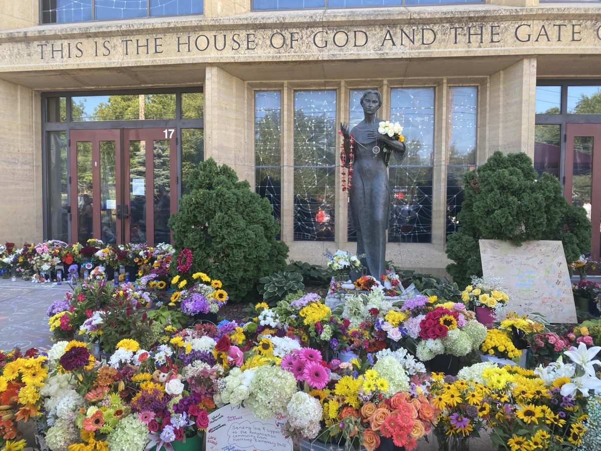 Flowers outside Annunciation Church and School as students returned to classes after the shootings. (photo: Wikimedia Commons)